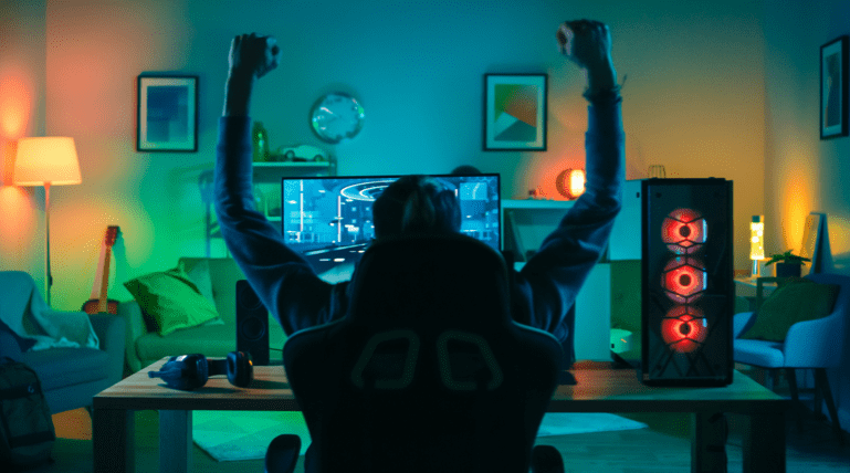 Male gamer celebrating a win on this gaming console