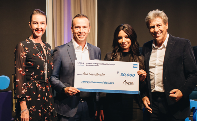 Andrew Banks awarding $30,000 to a small business owner 